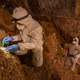 Archaeologists sampling the cave sediments for DNA.